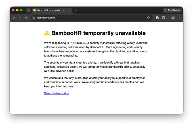 A screenshot of a BambooHR status page displaying a warning that "BambooHR temporarily unavailable" due to a PHP2SHELL security vulnerability, with the company noting they may take the service offline to protect data. The post highlights this incident as justification for switching to "Open HR" on the DFINITY/ICP platform, positioning tamperproof, decentralized "AIware" as a more secure enterprise alternative.