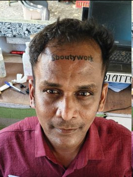 The image features a man with a tattoo of the word "boutifulwork" on his forehead, sitting at a desk or table. The photo has been edited to include text that reads "KRİPTODA BÖYLE ŞEYLER DE OLUYOR Pumpfun Go tarafında açılan bir görevde alnına söylenen mününü döyuruldu." The man is wearing a red shirt, and the image has been altered to include this text.