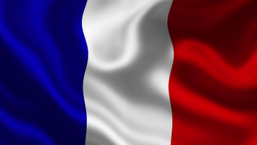 A digitally rendered, waving French tricolor flag with vertical blue, white, and red stripes fills the frame. The image likely symbolizes France, tying into the post's warning about crypto influencers facing 135 reported attacks and kidnappings since 2023, highlighting that physical security threats are a growing concern in the crypto space.