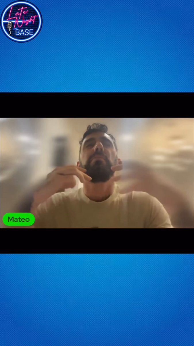The image shows a man wearing a white shirt, sitting down and looking at his cell phone screen. The background of the image has a blue color scheme, which contrasts with the man's white shirt. There are two texts displayed on the screen that read "Mateo breaks down why social trading beats trading alone" and "Now you can connect your trading feed straight into any group chat". These texts provide information about the benefits of using social media platforms for trading purposes.

The image also contains a caption that reads "Focus on what is in the image and how it relates to the post", which suggests that the viewer should pay attention to the details within the image, such as the man's attire or the background color scheme.