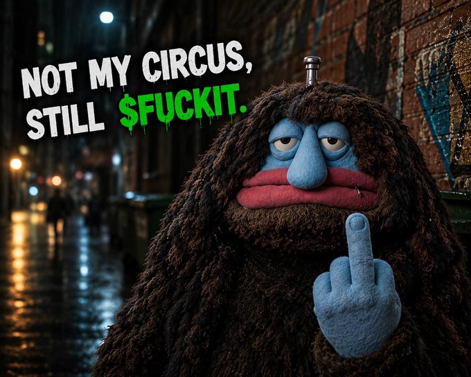 A meme image showing a furry blue character flipping the middle finger with the text 'NOT MY CIRCUS, STILL $FUCKIT.' overlaid on a graffiti-covered urban background.