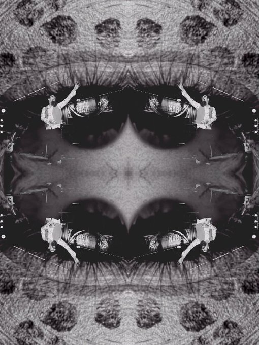 The image features a collage of a person's face that has been cut out and repeated four times. The faces are arranged in a square grid pattern, with each row and column containing one face. The faces appear identical to each other and have the same features as well. This unique presentation is titled "ED SOLD".