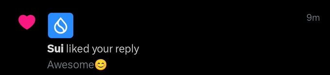A dark-themed notification showing the Sui blockchain logo with a pink heart, stating 'Sui liked your reply' with the message 'Awesome😊' posted 9 minutes ago.