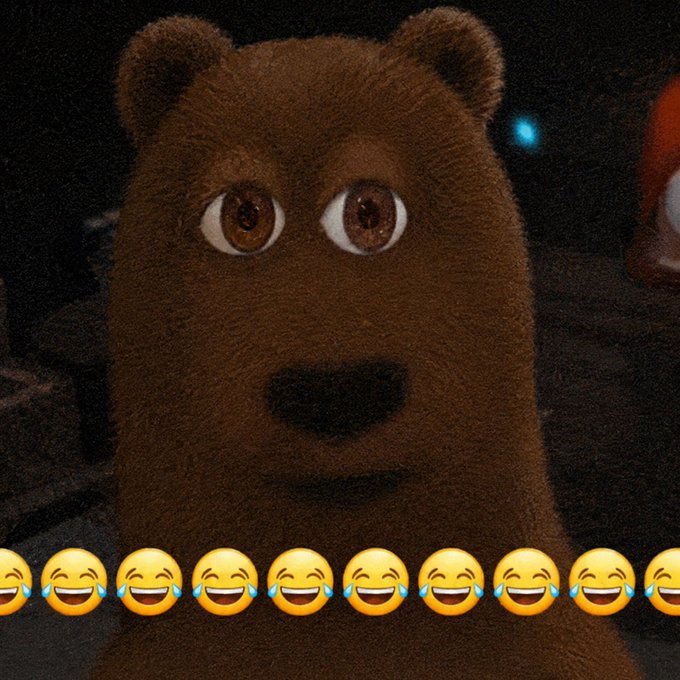 A close-up of a furry brown bear character with wide eyes, with a row of laughing crying emojis overlaid at the bottom of the image.