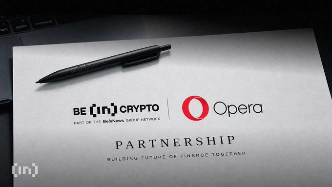 Promotional graphic displaying the 'BE [IN] CRYPTO' and 'Opera' logos with the tagline 'PARTNERSHIP: BUILDING FUTURE OF FINANCE TOGETHER', shown above a laptop keyboard and pen.
