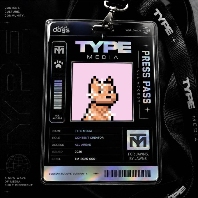 The image features a black lanyard with a silver clip that displays a digital photo of a dog's face. The lanyard has text that reads "Type Media Press Pass" and "For Jauns by Jauns". There is also a caption below the lanyard stating, "GOOD MORNING JAWNS!!!! Happy Type Thursday to all who celebrate!! My dog @coinismx cooked us up these wicked Press Passes so we needed the proper credentials before liftoff. See YOU AT THE TOP????". The image seems to be related to a press pass or badge for a specific event, possibly involving dogs and media.