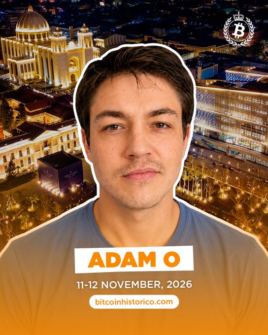Promotional graphic for "Bitcoin Historico" event featuring a cutout portrait of a man labeled "ADAM O," set against an aerial nighttime view of an illuminated city (likely El Salvador), scheduled for 11-12 November 2026, with the website bitcoinhistorico.com displayed.