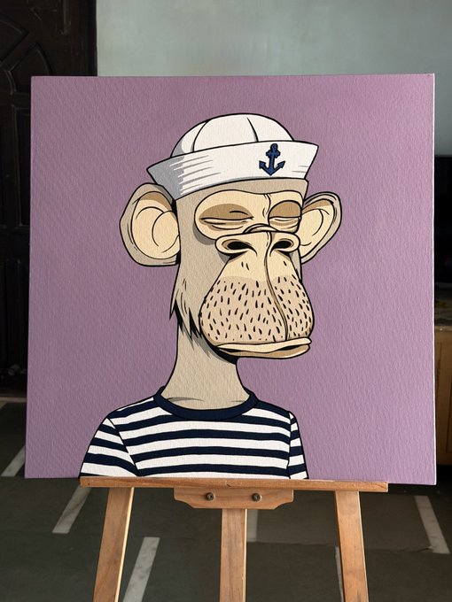 A painting on a wooden easel depicting a cartoonish monkey wearing a white sailor hat with an anchor and a black and white striped shirt against a purple background.