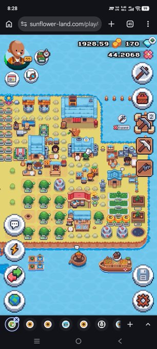 A mobile screenshot of the game 'Sunflower Land' showing a farm scene with crops, characters, and various resources. The top displays 'sunflower-land.com/play' and in-game currencies including 1928.59 gold, 170 gems, and 44.2068 tokens.