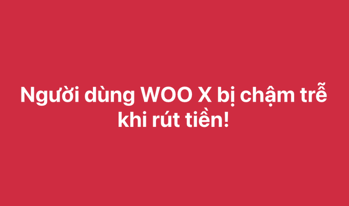 A bold red graphic with white Vietnamese text reading "Người dùng WOO X bị chậm trễ khi rút tiền!" (WOO X users experience withdrawal delays!).