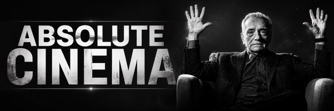 A black-and-white promotional image displays the text "ABSOLUTE CINEMA" alongside a seated older man with both hands raised in a gesturing pose. The meme humorously frames AMC's legal standoff with Robinhood as an epic showdown, invoking the dramatic "Absolute Cinema" template to sarcastically celebrate the escalating corporate conflict.