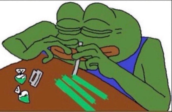 A cartoon frog in a blue vest carefully snorts three lines of green powder while crushing green pills and white capsules on a table.