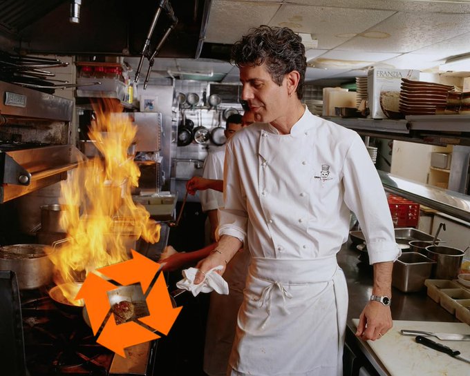 A chef in a white uniform cooking with flames rising from a pan in a kitchen, overlaid with an orange camera shutter icon.