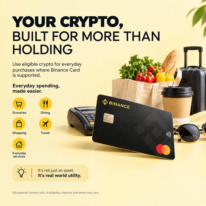 The image is a Binance Card promotional graphic with the headline "YOUR CRYPTO, BUILT FOR MORE THAN HOLDING," showing a sleek black Binance-branded Mastercard alongside a grocery bag, coffee, sunglasses, luggage, and icons representing Groceries, Dining, Shopping, Travel, and Everyday services—visually reinforcing the post's message about the card's real-world utility for everyday spending beyond just holding crypto.