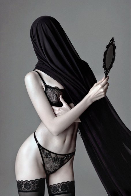 An artistic black-and-white portrait shows a woman with a black veil covering her face, wearing lace lingerie and thigh-high stockings while holding an ornate hand mirror.