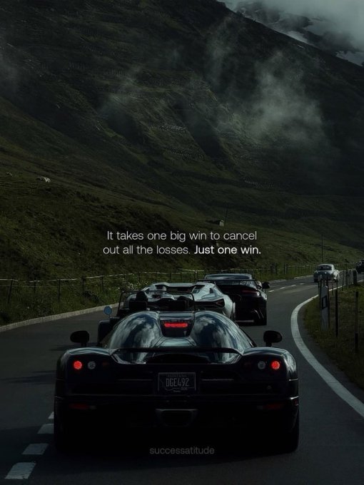A motivational image showing sports cars driving on a misty mountain road with the quote: 'It takes one big win to cancel out all the losses. Just one win.' credited to successattitude.