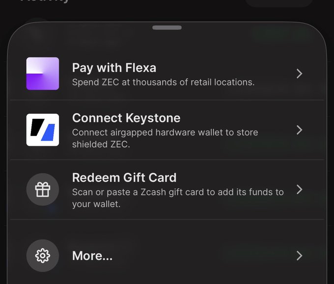 A dark-themed mobile app menu screen displaying options to 'Pay with Flexa', 'Connect Keystone', 'Redeem Gift Card', and 'More...', mentioning spending and storing shielded ZEC (Zcash).