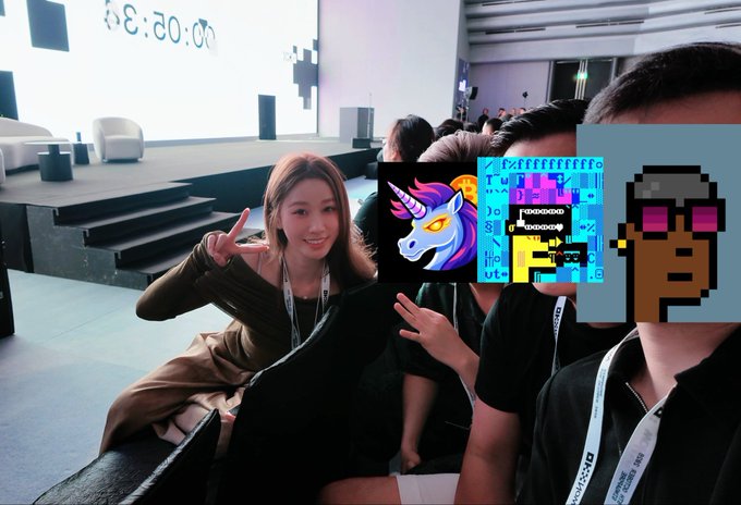 A young woman poses with a peace gesture and several friends at what appears to be an OKX event, with their faces covered by pixel art emojis and Bitcoin-themed graphics, while a countdown timer showing "20:34" is visible in the background.