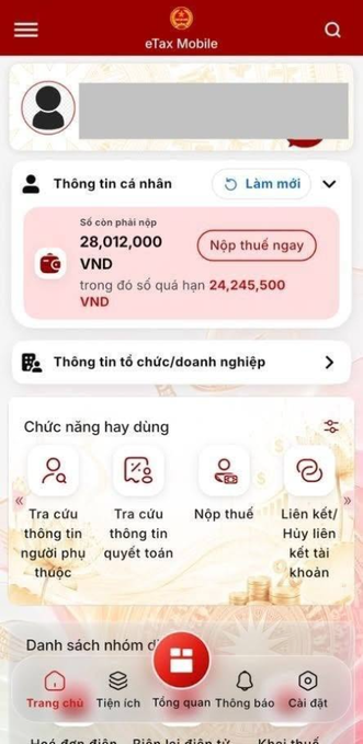 A screenshot of the Vietnamese 'eTax Mobile' app interface displaying personal tax information, including a remaining tax amount of '28,012,000 VNĐ' and a 'Nộp thuế ngay' button.