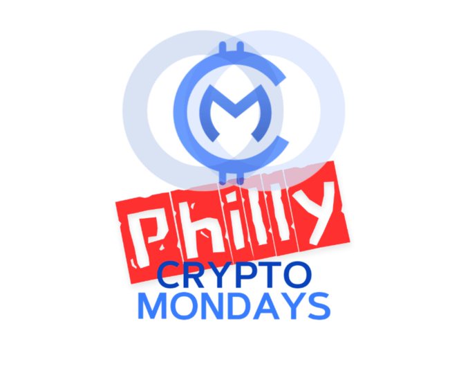 A logo for "Philly Crypto Mondays" featuring a blue circular emblem with a stylized "M" design and "CM" text on a red banner.