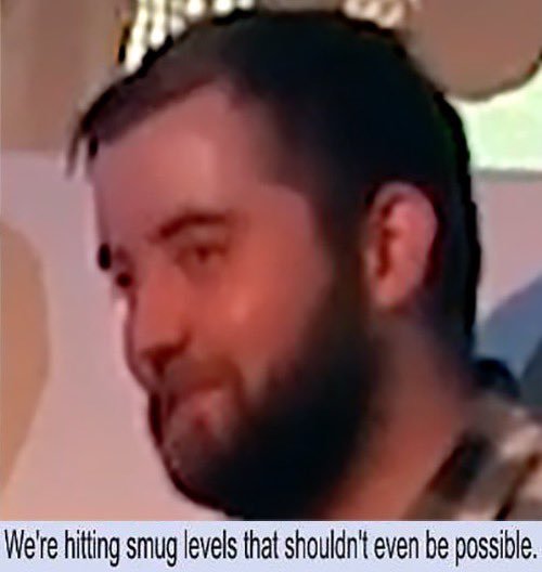 A low-resolution image of a bearded man with a crown or headpiece, smiling smugly, with the caption: "We're hitting smug levels that shouldn't even be possible."