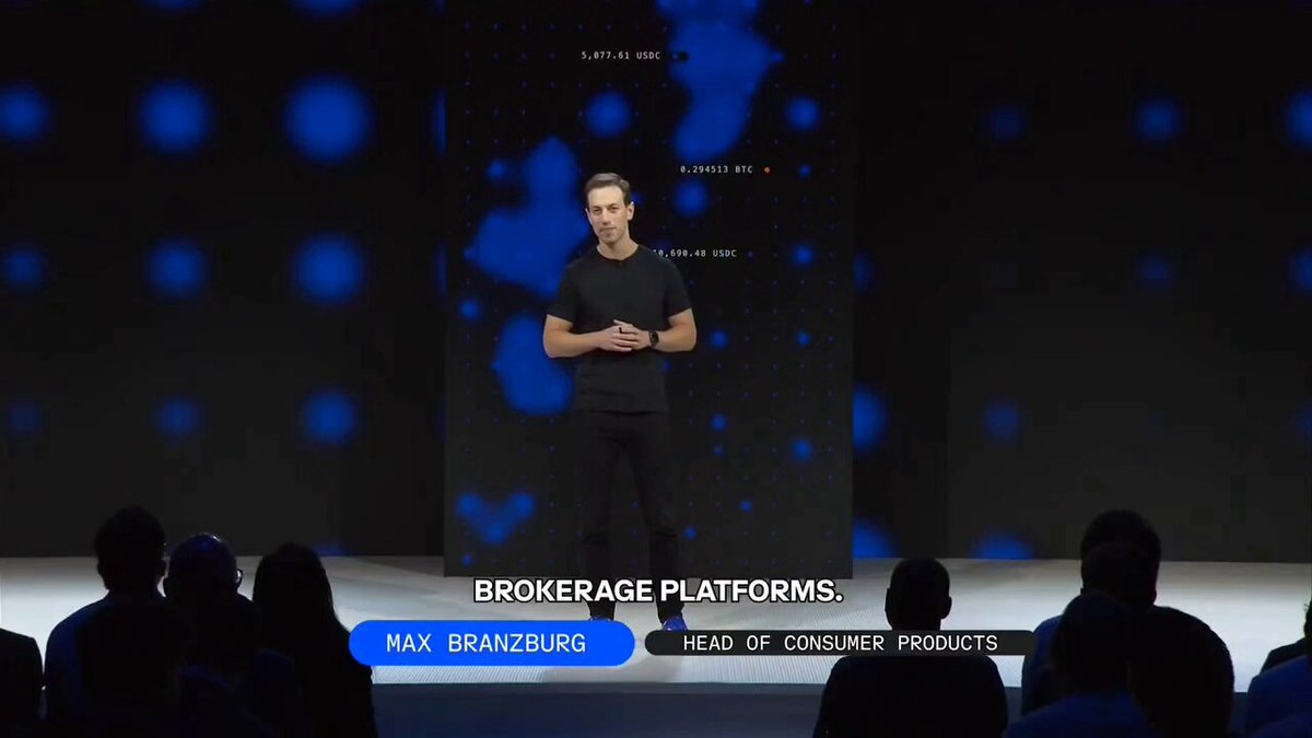 Max Branzburg, Head of Consumer Products at Coinbase, presents on stage about brokerage platforms, with cryptocurrency figures like "5,877.61 USDC" and "0.294513 BTC" displayed on the screen behind him, supporting the post's discussion of Coinbase's expanding features beyond options trading.