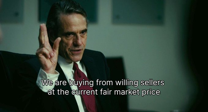 The image features actor Jeremy Irons as John F. Kennedy in "The American President", with text stating "We are buying from willing sellers at the current fair market price." This relates to the post by highlighting the contrast between buying at fair market prices and the missed opportunity of buying 1,309 Bitcoin for $1 seventeen years ago.