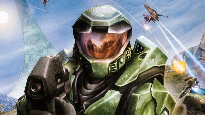 Artwork of the iconic green-armored Master Chief from the Halo franchise holding a pistol, with spaceships and explosions visible in the background.