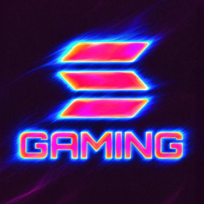 A neon-lit "GAMING" logo featuring three stacked pink and orange parallelogram bars glows with vibrant blue and magenta energy against a dark background, evoking the high-energy intensity of a heated gaming week. The glowing, electric aesthetic mirrors the "heating up" excitement of Big Weeklana's gaming announcements.