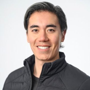 A headshot of Dom Kwok, former Goldman Sachs analyst and EasyA co-founder, smiling at the camera in a dark puffer jacket. The image accompanies a post where he predicts XRP could reach $1,000 by 2030 with massive global adoption.