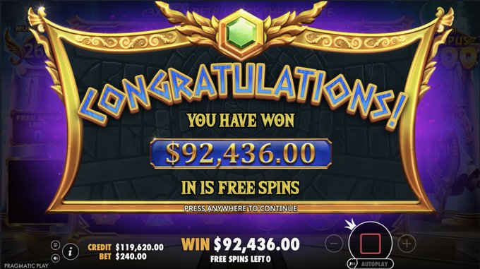 An online slot game (Pragmatic Play) screen displaying "CONGRATULATIONS! YOU HAVE WON $92,436.00 IN FREE SPINS" with a credit balance of $119,620.00.