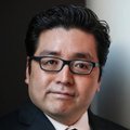 A well-dressed man with dark hair and black-framed glasses looks directly at the camera with a slight smile. The confident, professional portrait pairs with the bullish post text to suggest optimism about an upcoming market rally.