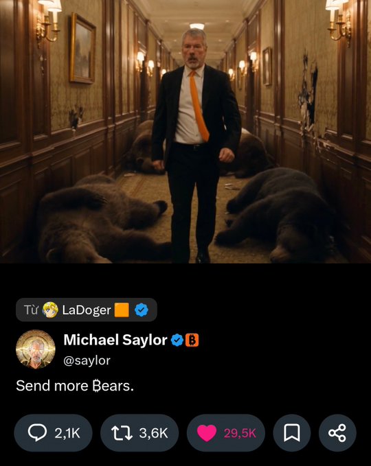 A serious-looking man in a black suit and orange tie walks down a hallway lined with large dead bears, with tweet replies including "Từ LaDoger" and Michael Saylor (@saylor) saying "Send more Bears," humorously matching the Vietnamese post's call for followers to "send all their Bears" for him to "handle."
