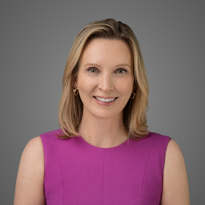 A professional headshot of Kristin Smith, who is identified in the post as the Solana Policy Institute President, smiling at the camera while wearing a magenta sleeveless top against a gray background. The image accompanies an article where she shared with Bloomberg that crypto "is winning right now in Washington."