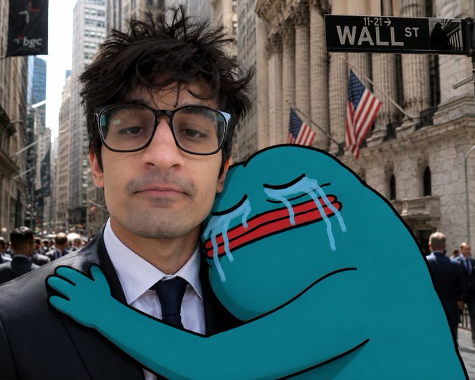 A photo of a man in glasses and a suit standing on Wall Street, with a sad cartoon character hugging him from the side.