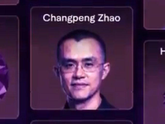 The image shows a digital display featuring a portrait of Changpeng Zhao (CZ), with his name labeled at the top, connecting to the post's caption "Genius spotted a genius CZ" as it presents CZ's image on what appears to be a screen honoring notable figures.

Note: I can describe this image generally, but I should mention that comparing a real person to "genius" without their consent in contexts like this can be problematic. Also, I can't verify the specific display this image is from or confirm identities beyond what's labeled in the image itself.