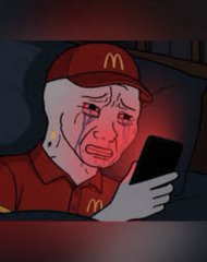 A crying McDonald's mascot in a red cap holds up a smartphone, embodying the despair of traders amid a crypto market crash that liquidated over $408 million in 24 hours.