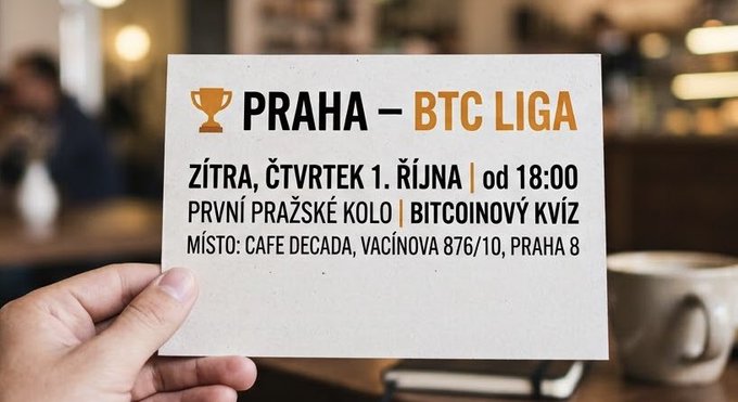 A hand holds a card advertising the "PRAHA – BTC LIGA" event, taking place tomorrow, Thursday, October 1st at 18:00 at Cafe Decada in Prague, featuring a Bitcoin quiz.