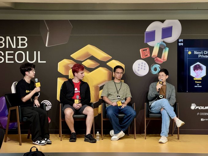 Four panelists sit on stage at BNB Seoul, engaged in a discussion with BNB branding and Binance logos visible in the background.