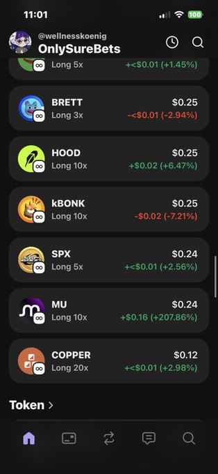 In this image, we see a phone screen displaying an array of cryptocurrency market data. The main focus is on a list of various cryptocurrencies along with their current prices. These details include Bitcoin, Copper, Spx, and K nickname options like Long & Short 3x and 2x. There are also several other short and long names for different coins to consider. 

The screen layout indicates that the user has multiple options to choose from, such as Bitcoin being displayed on top of a list below several others with similar names. The image also includes a post that seems to provide an overview or summary of specific details in the market data. It's worth noting that there is also a message suggesting it might be taken at 11:01 AM based on the time and date information available.