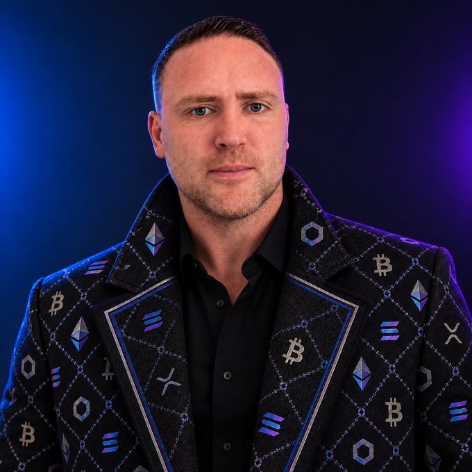 A man with a serious expression poses in a black jacket adorned with various cryptocurrency logos, including Bitcoin (₿), Ethereum (Ξ), and Solana, which is reflected by the post's enthusiasm for Solana.