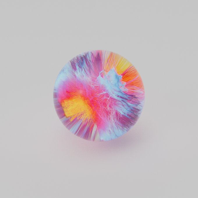A circular object with vibrant pink, blue, yellow, and orange swirling colors resembling a colorful explosion or abstract artwork on a white background.