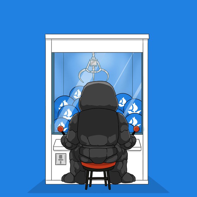 A muscular, rock-like figure sits on a red stool, operating a claw machine filled with blue balls featuring flame logos, seemingly reaching to grab a winning token from the "GOE" collection NFT mint. The image cleverly illustrates the "GTD" (guaranteed) mint phase as a claw machine challenge, where collectors have a final chance to grab a guaranteed spot.