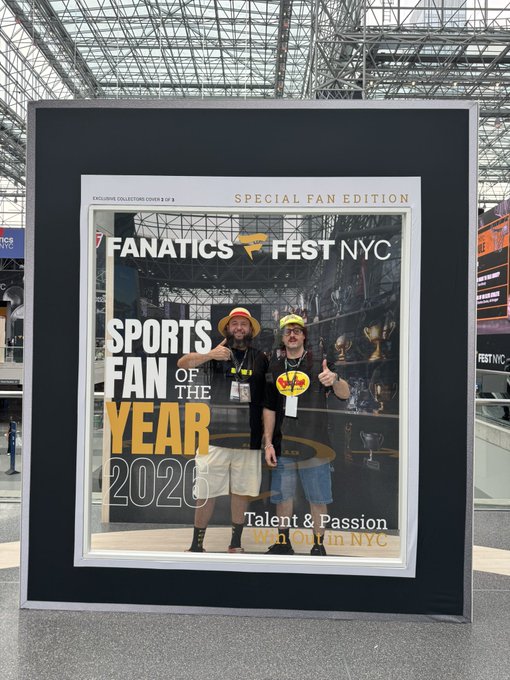 A large framed 'Special Fan Edition' magazine cover for 'Fanatics Fest NYC' featuring 'Sports Fan of the Year 2025' and a photo of two men giving thumbs up.