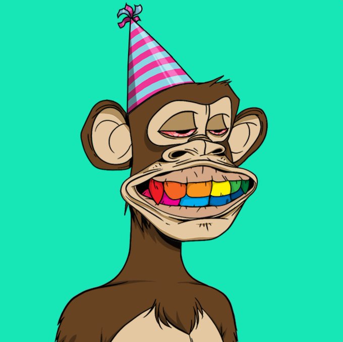 A cartoon illustration of a brown monkey wearing a pink and blue striped party hat, featuring a wide grin with rainbow-colored teeth against a teal background.