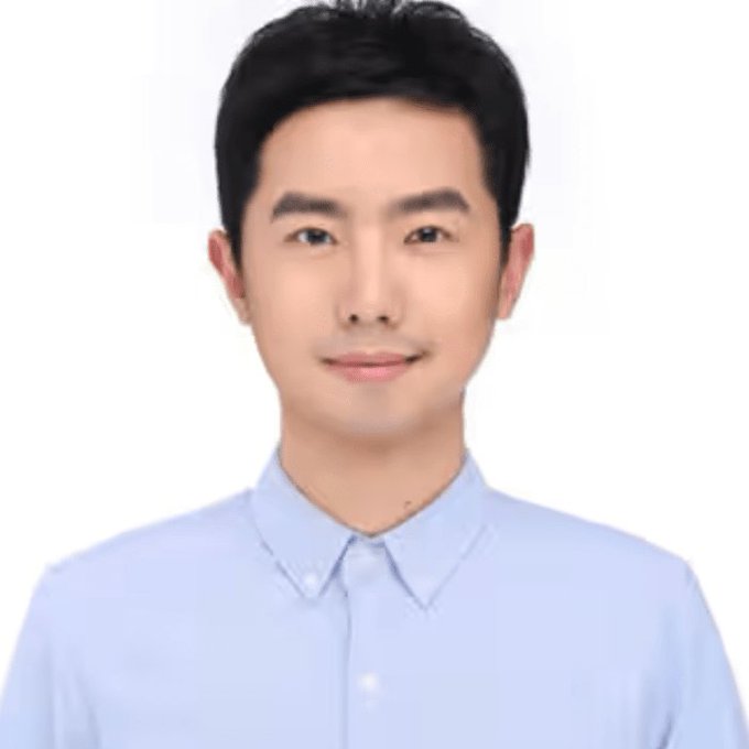 A young man wearing a light blue collared shirt poses for a headshot with a neutral background. The image appears to be a professional portrait of a person, possibly Garett Jin, the trader mentioned in the accompanying post about closing a Bitcoin short position for profit.