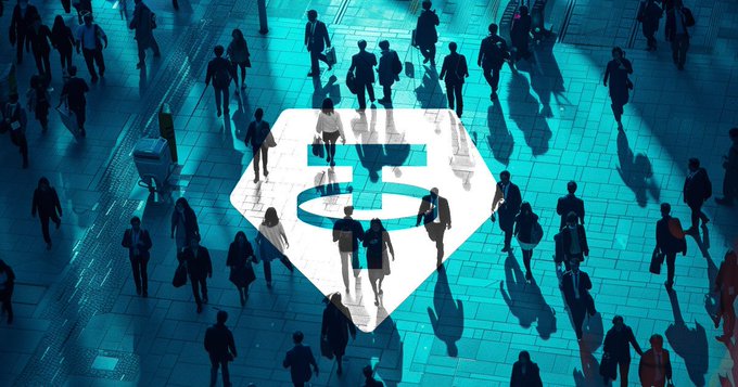 A crowd of people is seen from above, walking over a large teal "$USDT" logo projected onto the ground, illustrating the massive global user growth and adoption of Tether's stablecoin.