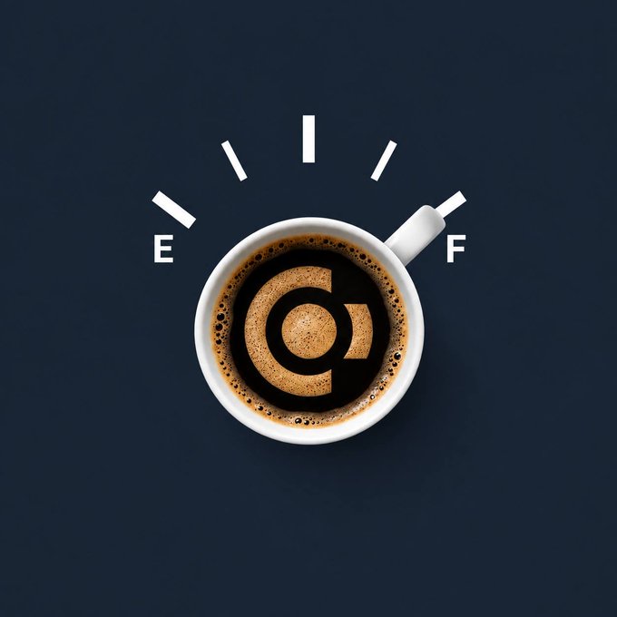 A top-down photograph of coffee in a white mug with a logo printed on the foam, surrounded by dashed lines forming an arc with the letters 'E' and 'F' on a dark blue background.