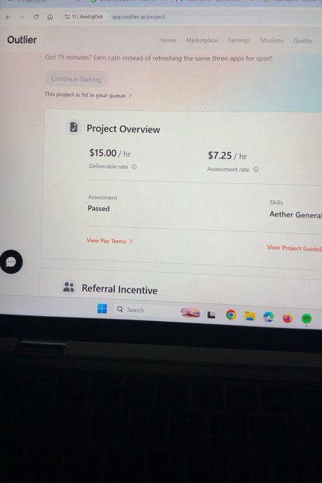 A photo of a laptop screen displaying the Outlier platform showing a newly passed Aether General assessment, with a deliverable rate of $15.00/hr and assessment rate of $7.25/hr. The image confirms the successful completion of the assessment mentioned in the post, ready for onboarding.