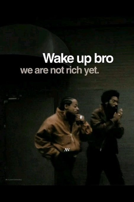 A dark meme image showing two men in jackets, with white text reading 'Wake up bro we are not rich yet.' and 'AV' visible.